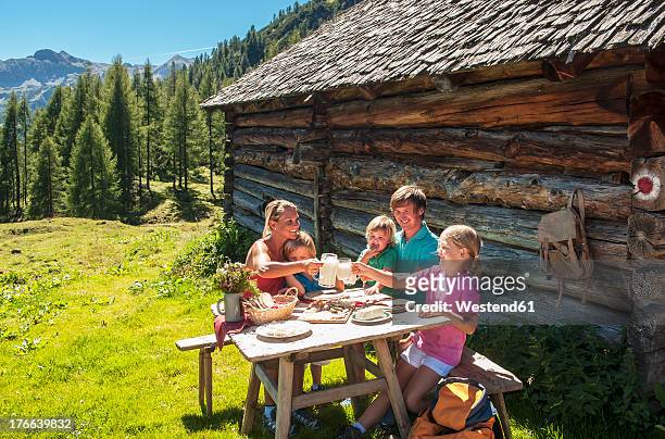 austria, salzburg country, family having rest at altenmarkt zauchensee - berghütte stock-fotos und bilder