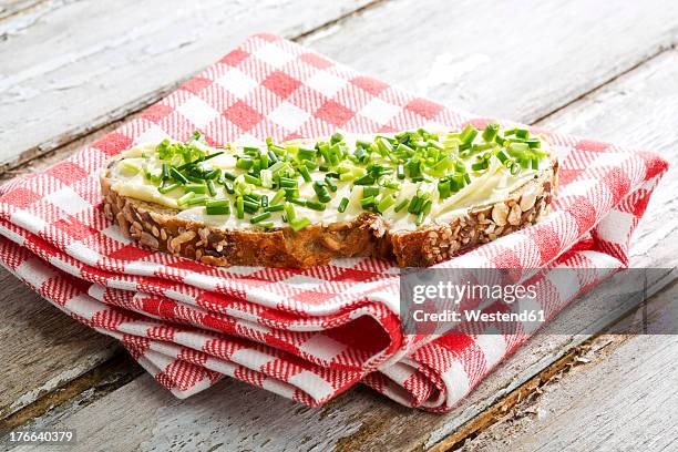 butter and chives on whole grain bread, close up - napkin stock pictures, royalty-free photos & images