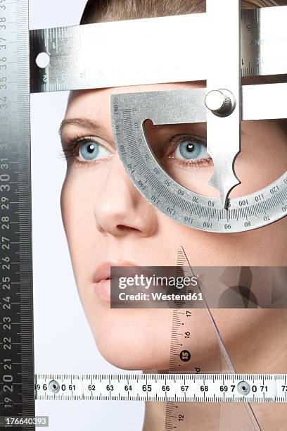 young woman with geometric instruments, close up - face symmetry stock pictures, royalty-free photos & images