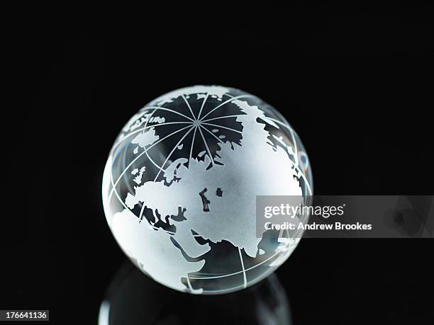 glass globe illustrating asia, india, china, russia, africa, saudi arabia, middle east - east india company fotografías e imágenes de stock