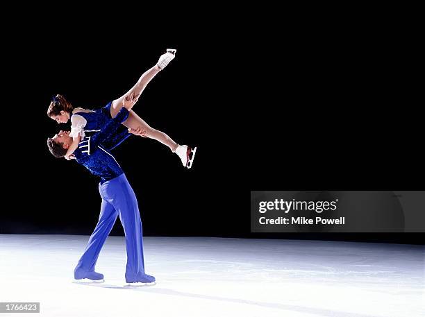 Figure skating pair, man lifting woman