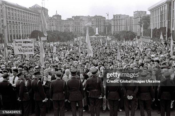 Participants of the Ukrainian Popular Assembly, some of whom wearing the uniform of Ukrainian Sich Riflemen hold flags and banners with slogans "Put...