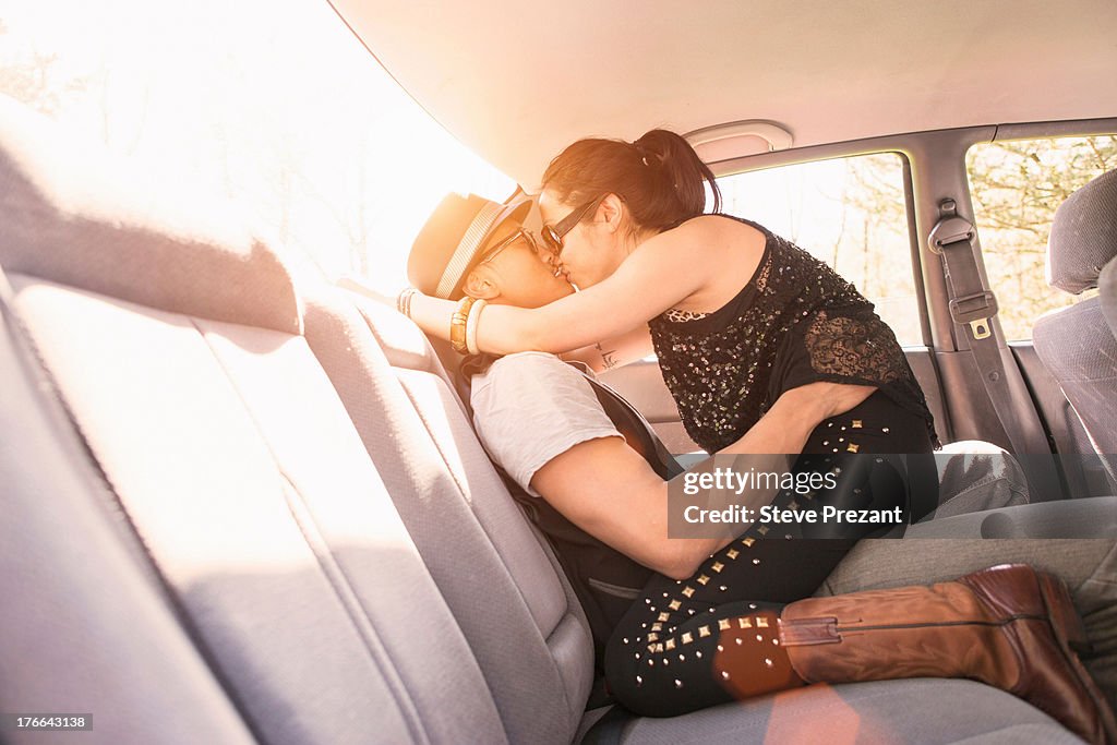 Couple in car, kissing