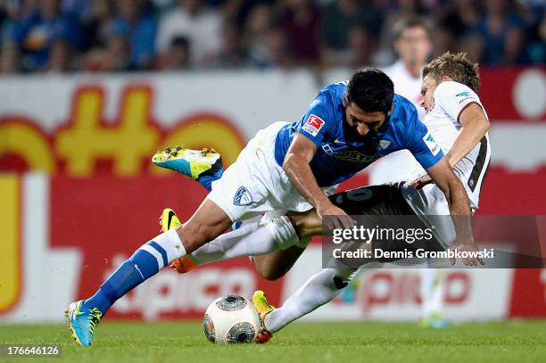 Mirkan Aydin of VfL Bochum and Christopher Buchtmann of St. Pauli battle for the ball during the Second Bundesliga match between VfL Bochum and FC...