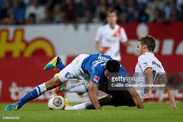 Mirkan Aydin of VfL Bochum and Christopher Buchtmann of St. Pauli battle for the ball during the Second Bundesliga match between VfL Bochum and FC...
