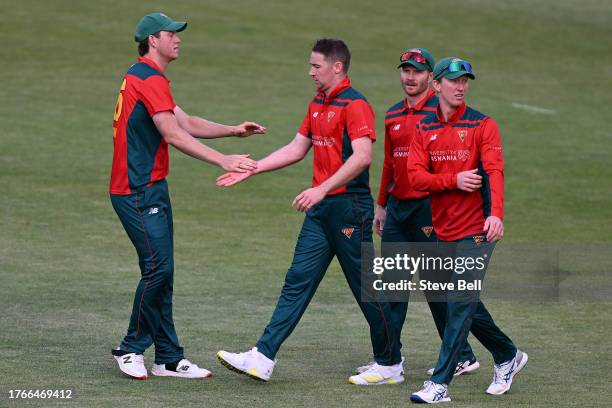 Tom Rogers of the Tigers celebrates the wicket of Joe Burns of the Bulls during the Marsh One Day Cup match between Tasmania and Queensland at...