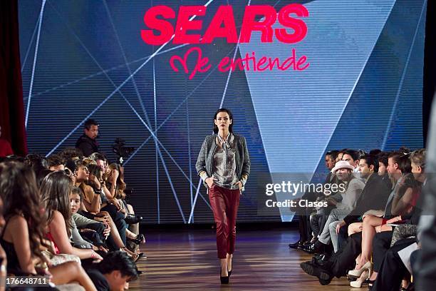 Model walks the runway during the Sears Fashion Parade - Autumn/Winter 2013 at the Casino Español on August 15, 2013 in Mexico City, Mexico.