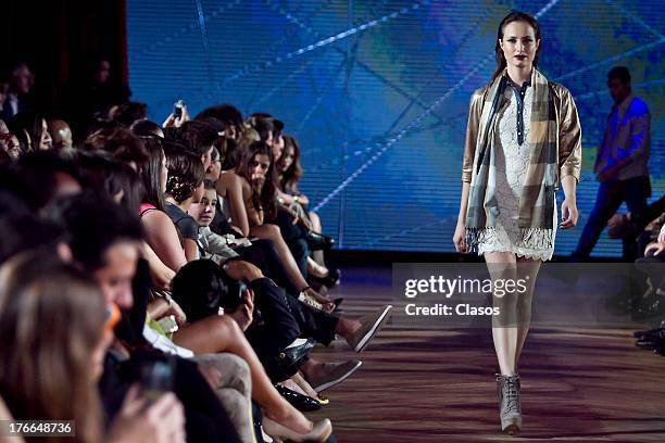 Model walks the runway during the Sears Fashion Parade - Autumn/Winter 2013 at the Casino Español on August 15, 2013 in Mexico City, Mexico.