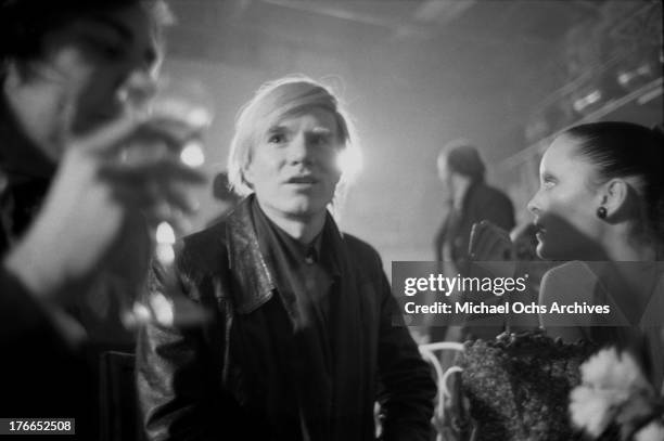 Artist Andy Warhol and actress and model Jane Forth attend the party for the premiere of the movie 'Trash' on February 19, 1971 in Munich, West...