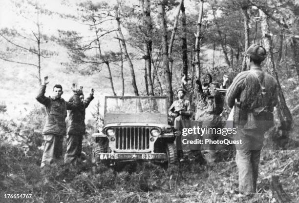 Photo received from Beijing, China showing Communist soldiers capturing American soldiers during the Korean War, Wonson, North Korea, 1951.