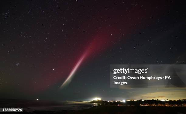 Strong thermal emission velocity enhancement, a rare aurora-like phenomenon named a STEVE in 2016 by scientists in Canada, can be seen over Bamburgh...