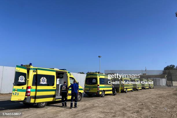Ambulances queue to cross the Rafah border from the Egyptian side to transport the injured from Gaza to receive treatment on November 6, 2023 in...