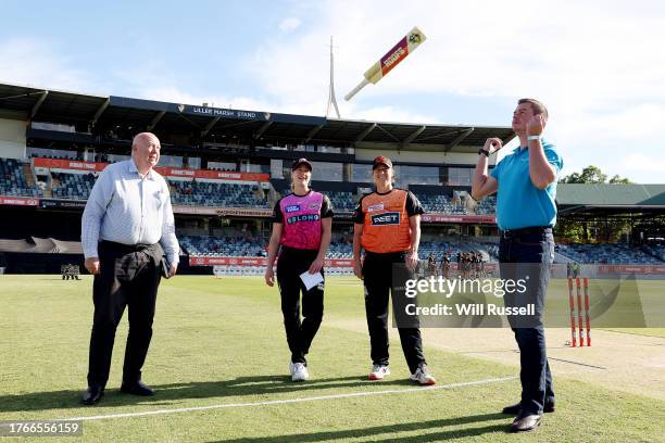 Ellyse Perry of the Sixers and Sophie Devine of the Scorchers look on at the the bat flip during the WBBL match between Perth Scorchers and Sydney...