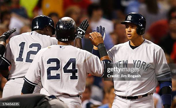 Alex Rodriguez of the New York Yankees greets Alfonso Soriano of the New York Yankees, who hit a three-run home and Robinson Cano, who was on base,...