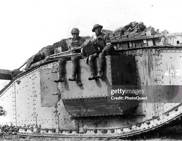 American photographers going into the battle lines on a British Army tank, between Villeret and Bellicourt, France, September 29, 1918.