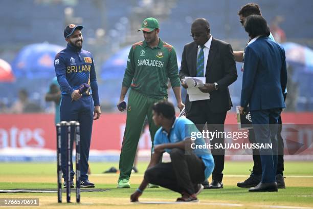 Sri Lanka's captain Kusal Mendis and his Bangladesh counterpart Shakib Al Hasan gesture during the toss before the start of the 2023 ICC Men's...