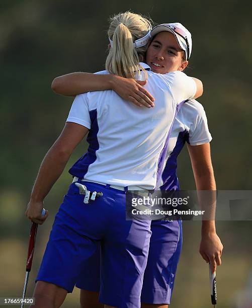 Suzann Pettersen of Norway and Carlota Ciganda of Spain and the European Team celebrate on the 18th green after defeating Stacy Lewis and Lexi...
