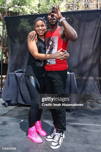 Singer Jason Derulo brings singer Jordin Sparks onstage during his performance at the WBR Summer Sessions at Warner Bros. Records Boutique Store on...