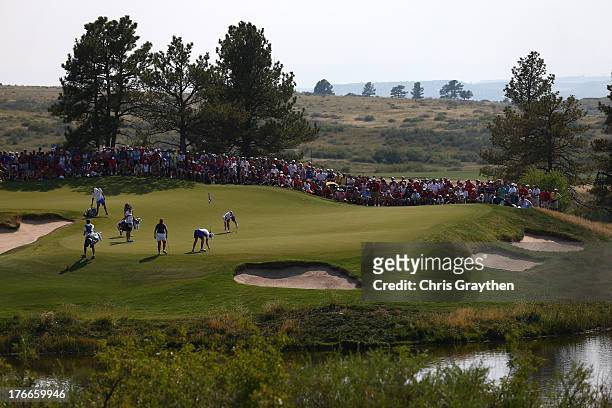 Caroline Hedwall of Sweden and Caroline Masson of Germany and the European Team walk onto the 11th green with Angela Stanford and Gerina Piller of...