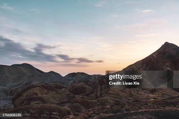 mountain range at sunset - royalty free stock-fotos und bilder