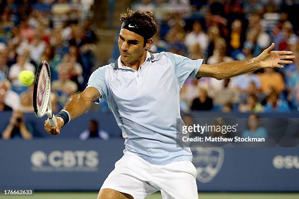 Roger Federer of Switzerland returns a shot to Rafael Nadal of Spain during the Western & Southern Open on August 16, 2013 at Lindner Family Tennis...