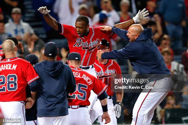 Justin Upton of the Atlanta Braves celebrates after hitting a solo walk-off homer in the 10th inning against the Washington Nationals at Turner Field...