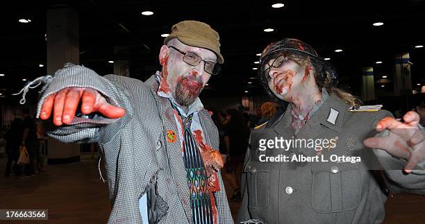 Cosplayers Jim Fox and Genevieve Fox as zombies attend Day 1 Wizard World Chicago Comic Con held at Donald E. Stephens Convention Center on August 9,...