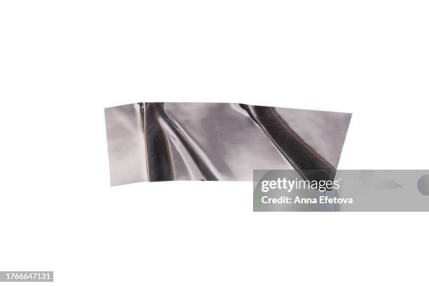 festive silver metallic wrinkled adhesive tape. festive design element for multiple types of graphic design decorations. isolated on white background, cut out. textured, high resolution - thin ribbon stock pictures, royalty-free photos & images