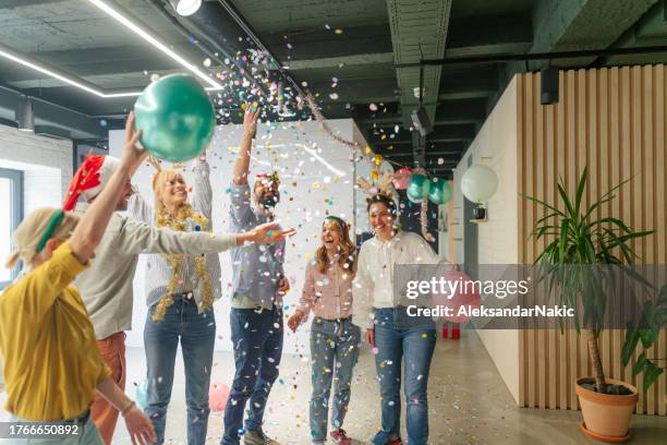 christmas party in the office - holiday spirit stock pictures, royalty-free photos & images