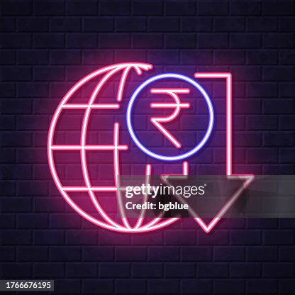 Indian rupee rate decrease. Glowing neon icon on brick wall background Indian rupee rate decrease. Glowing neon icon on brick wall background
