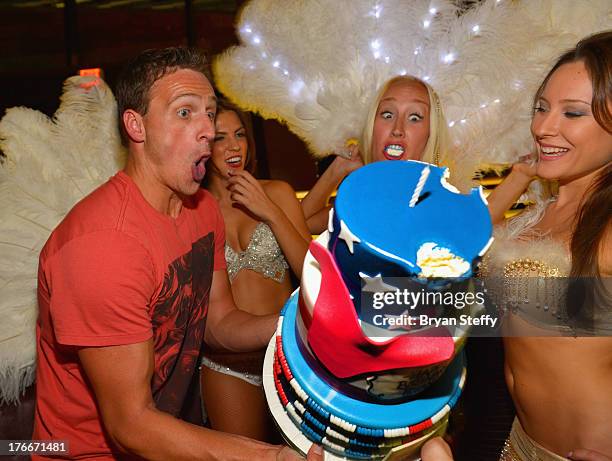 Olympic swimmer Ryan Lochte poses with a birthday cake as he appears at SHe by Morton's at Crystals at CityCenter to celebrate his birthday on August...