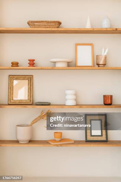 close-up of assorted ornaments, vases and mirrors on shelves - continental_shelf stock pictures, royalty-free photos & images