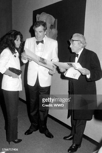 Ann Biderman, Roger Vadim, and Marcel Dalio attend an event at the Los Angeles County Museum of Art in Los Angeles, California, on July 12, 1982.