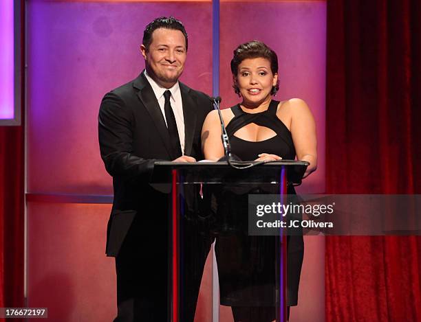 Actors Hector Bustamante and Justina Machado speaks during the 28th Annual Imagen Awards at The Beverly Hilton Hotel on August 16, 2013 in Beverly...