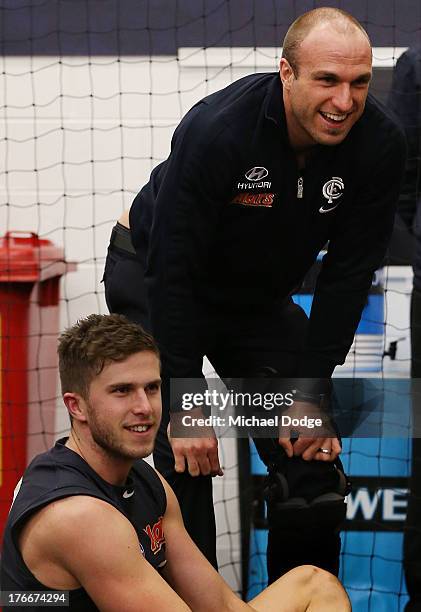 Marc Murphy and Chris Judd of the Blues catch up after the round 21 AFL match between the Richmond Tigers and the Carlton Blues at Melbourne Cricket...