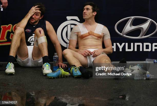 Jarrad Waite and Michael Jamison of the Blues sit down after the round 21 AFL match between the Richmond Tigers and the Carlton Blues at Melbourne...