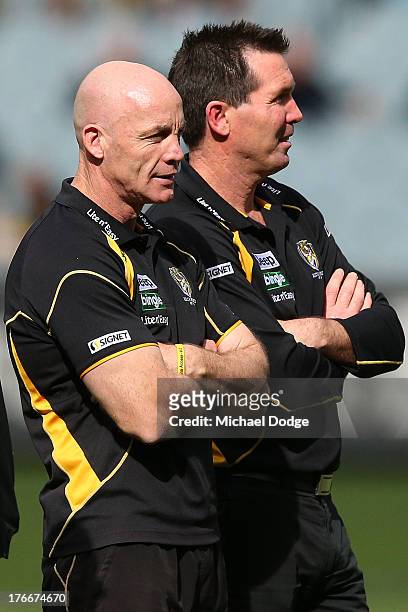 Tigers assistant coaches Ross Smith and Wayne Campbell look ahead during the round 21 AFL match between the Richmond Tigers and the Carlton Blues at...