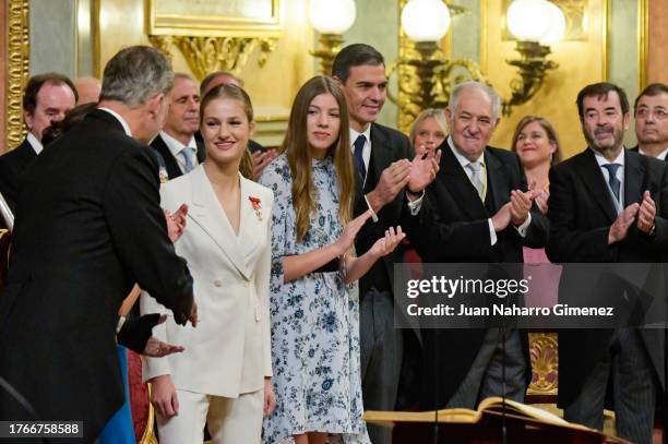 King Felipe VI of Spain, Princess Sofia of Spain, Spanish Prime Minister Pedro Sánchez and other applaude Crown Princess Leonor after swearing...