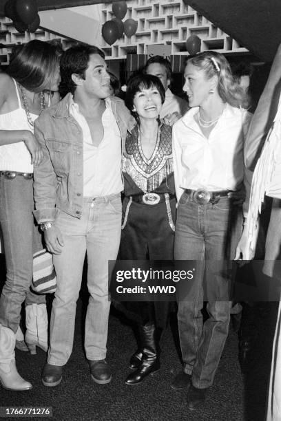 Chad McQueen, Neile Adams, and Terry McQueen attend an event at the Santa Monica Civic Auditorium in Santa Monica, California, on May 11, 1982.