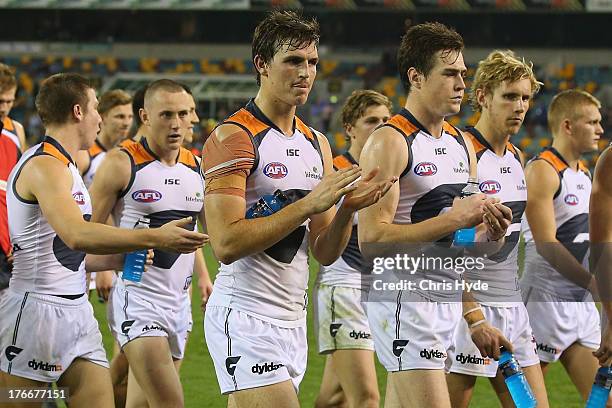 Giants leave the field after losing the round 21 AFL match between the Brisbane Lions and the Greater Western Sydney Giants at The Gabba on August...