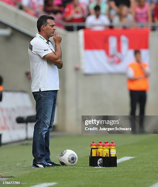 Headcoach Alois Schwartz of Sandhausen follows his team during the Second Bundesliga match between 1. FC Koeln and SV Sandhausen on August 17, 2013...