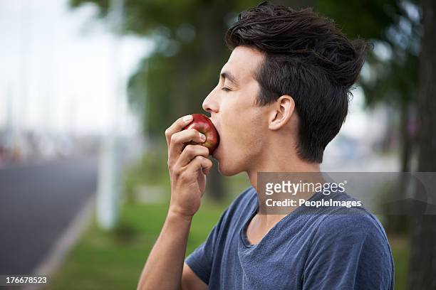 taking a bite - apple bite out stock pictures, royalty-free photos & images