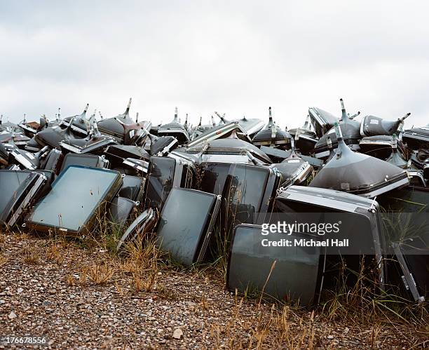 spent televisions at recycling yard - obsolete stock pictures, royalty-free photos & images