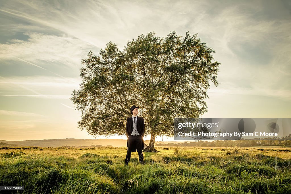 Man standing in front of tree