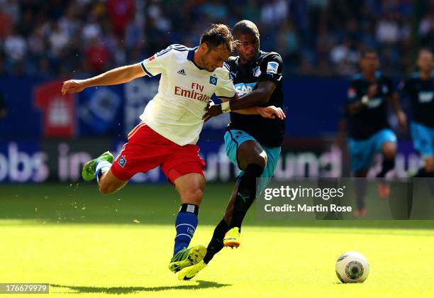 Heiko Westermann of Hamburg and Anthony Modeste of Hoffenheim battle for the ball during the Bundesliga match between Hamburger Sv and 1899...