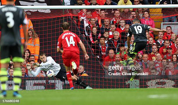 Simon Mignolet of Liverpool saves a penalty from Jonathan Walters of Stoke City during the Barclays Premier League match between Liverpool and Stoke...