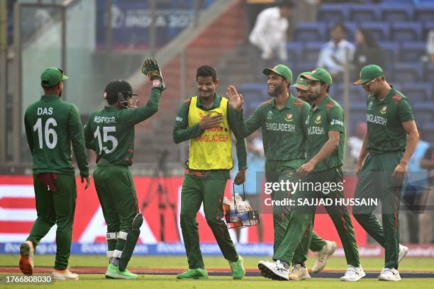 Bangladesh's players celebrate after the dismissal of Sri Lanka's Sadeera Samarawickrama during the 2023 ICC Men's Cricket World Cup one-day...