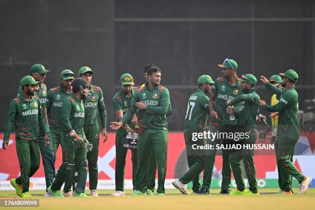 Bangladesh's players celebrate after the dismissal of Sri Lanka's captain Kusal Mendis during the 2023 ICC Men's Cricket World Cup one-day...