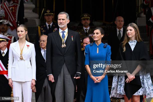 Crown Princess Leonor of Spain, King Felipe VI of Spain, Queen Letizia of Spain and Princess Sofia of Spain watch a military parade after the...