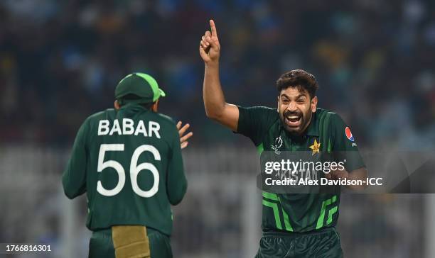 Haris Rauf of Pakistan celebrates the wicket of Shakib Al Hasan of Bangladesh with team mate Babar Azam during the ICC Men's Cricket World Cup India...